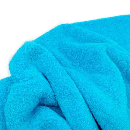 Tela de rizo de toalla algodón 100% en color azul turquesa