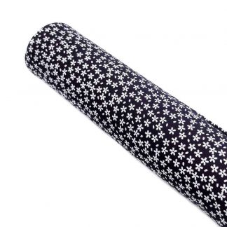 Tela de viscosa estampada con flores blancas tamaño liberty sobre fondo color negro