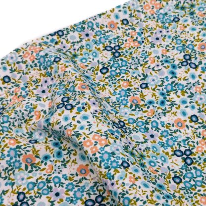 Tela de popelín 100% algodón estampada con flores tipo liberty en tonos jade