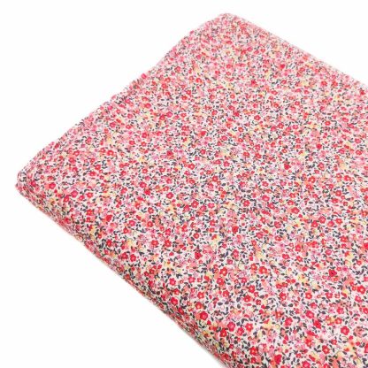 Tela de popelín 100% algodón estampada con flores tipo liberty en tonos rosas