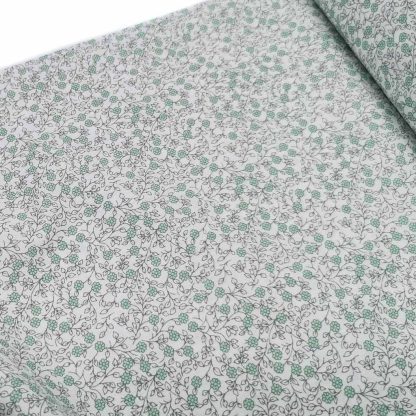 Tela de popelín 100% algodón con estampado de flores verde jade tamaño liberty sobre fondo color blanco. Minimals Poppy Fabrics Europe