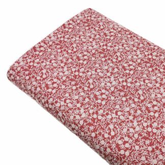 Tela de popelín 100% algodón con estampado de flores blancas tamaño liberty sobre fondo color grana. Minimals Poppy Fabrics Europe