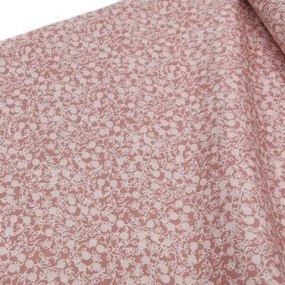 Tela de popelín 100% algodón con estampado de flores blancas tamaño liberty sobre fondo color rosa palo. Minimals Poppy Fabrics Europe