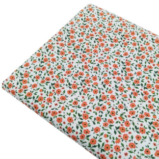 Tela de popelín con estampado de flores tipo liberty en color coralina