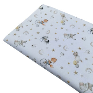 Tela piqué de canutillo con estampado de animalitos acróbatas, lunas y estrellas