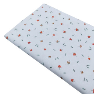 Tela de piqué de canutillo con estampado de setas rojas