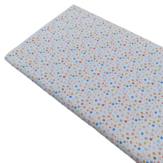 Tela de popelín con estampado de topitos de varios colores y formas