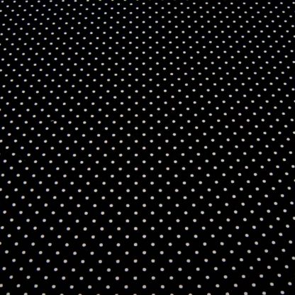 Tela de popelín 100% algodón con estampado de topos blancos pequeños sobre fondo color negro diseñado by Poppy Europe