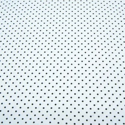 Tela de popelín 100% algodón con estampado de topos negros pequeños sobre fondo color blanco diseñado by Poppy Europe