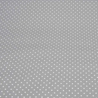 Tela de popelín 100% algodón con estampado de topos blancos pequeños sobre fondo color gris diseñado by Poppy Europe