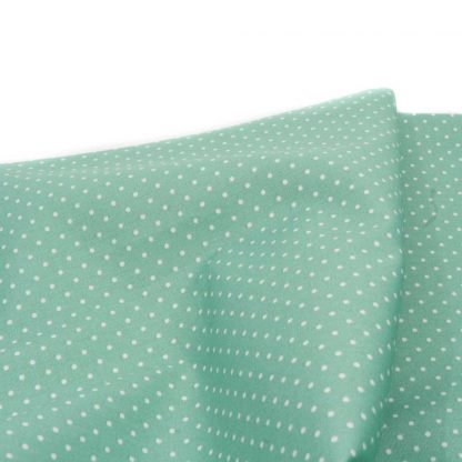 Tela de popelín 100% algodón con estampado de topos blancos pequeños sobre fondo color verde agua diseñado by Poppy Europe