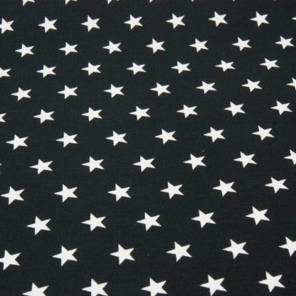 Tela de popelín 100% algodón con estampado de estrellas blancas pequeñas sobre fondo color negro diseñado by Poppy Europe
