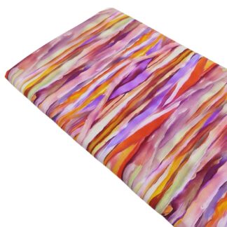 Tela de viscosa 100% con estampados tipo pinceladas de colores cálidos