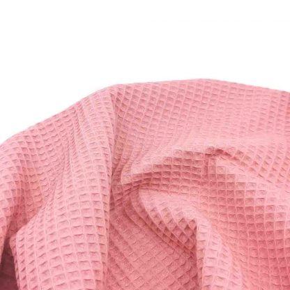 Tela waffle de algodón 100% en color rosa chicle