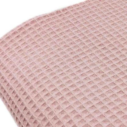 Tela waffle de algodón 100% en color rosa empolvado