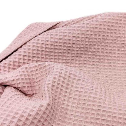 Tela waffle de algodón 100% en color rosa empolvado
