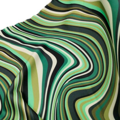 Tela de neopreno estampado con geométricos en forma de ondas en tonos verde