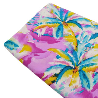 Tela 100% viscosa con estampado de palmeras de colores