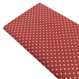 Tela de popelín estampado con lunares de color lino sobre fondo de color granate