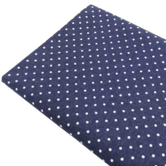 Tela de popelín estampado con lunares de color lino sobre fondo de color azul marino