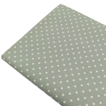 Tela de popelín estampado con lunares de color lino sobre fondo de color verde jade