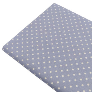 Tela de popelín estampado con lunares de color lino sobre fondo de color azul empolvado