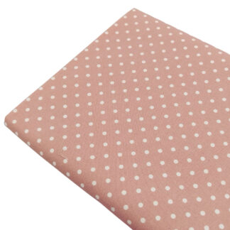 Tela de popelín estampado con lunares de color lino sobre fondo de color rose