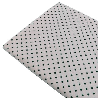 Tela de popelín estampado con lunares de color verde botella sobre fondo de color lino