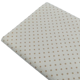 Tela de popelín estampado con lunares de color beige sobre fondo de color lino