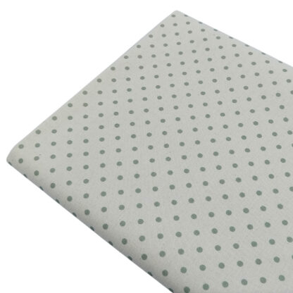 Tela de popelín estampado con lunares de color verde jade sobre fondo de color lino
