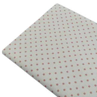 Tela de popelín estampado con lunares de color rose sobre fondo de color lino