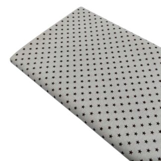 Tela de popelín estampado de estrellas chocolate sobre fondo color lino
