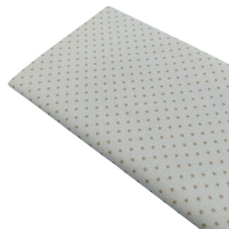 Tela de popelín estampado de estrellas beige sobre fondo color lino
