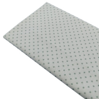 Tela de popelín estampado de estrellas verde jade sobre fondo color lino