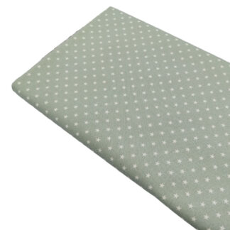 Tela de popelín estampado de estrellas color lino sobre fondo color verde jade