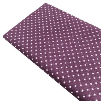 Tela de popelín estampado de estrellas color lino sobre fondo color berenjena