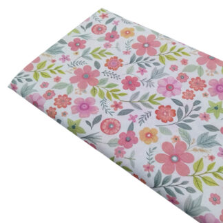 Tela de popelín con estampado de flores en tonos rosas