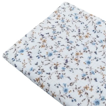 Tela doble gasa muselina con estampado de flores en tono azul