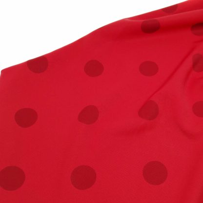 Tela para trajes de flamenca en crep elástico con lunares de 30 milímetros color sangre sobre fondo color rojo