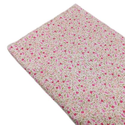 Tela de popelín 100% algodón con estampado de flores tipo liberty en tono rosa