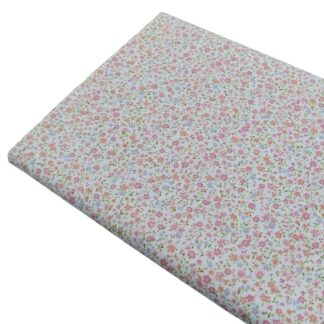 Tela de popelín con estampado de flores tipo liberty serie Brisa en tonos rosas empolvados
