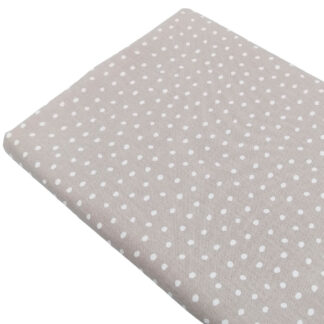 Tela de viyela estampada con lunares sobre fondo beige