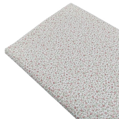 Tela de popelín con estampado de flores en tonos rosa empolvado