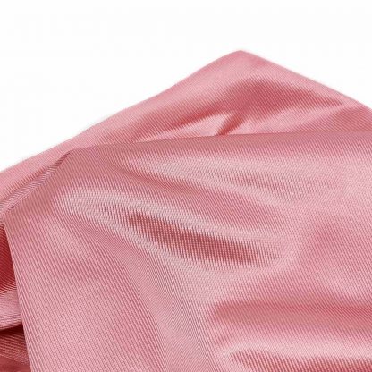 Tela de rasete en color liso rosa palo