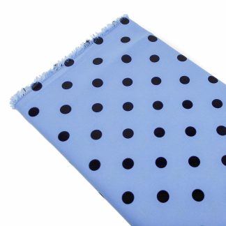 Tela especial para coser trajes de flamenca en crep elástico con estampado de lunares negros de 10 milímetros sobre fondo color azulado