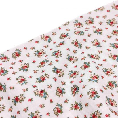 Tela doble gasa muselina de algodón orgánico GOTS estampada flores tonos rosas sobre fondo en color blanco
