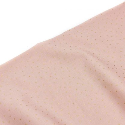Tela batista de algodón orgánico tipo voile estampada con mini topos color dorado sobre fondo color rosa empolvado